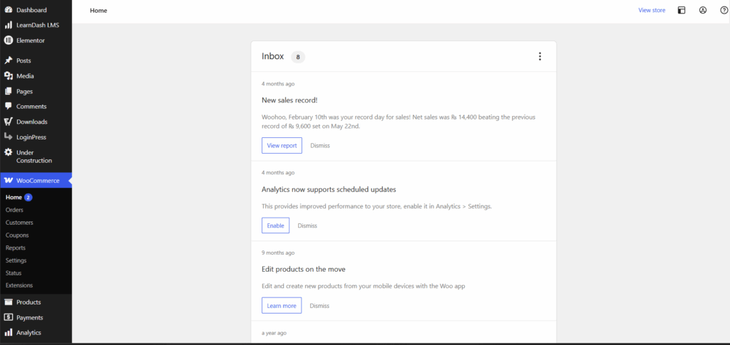 WooCommerce home dashboard backend showing an inbox with a new sales record notification panel.